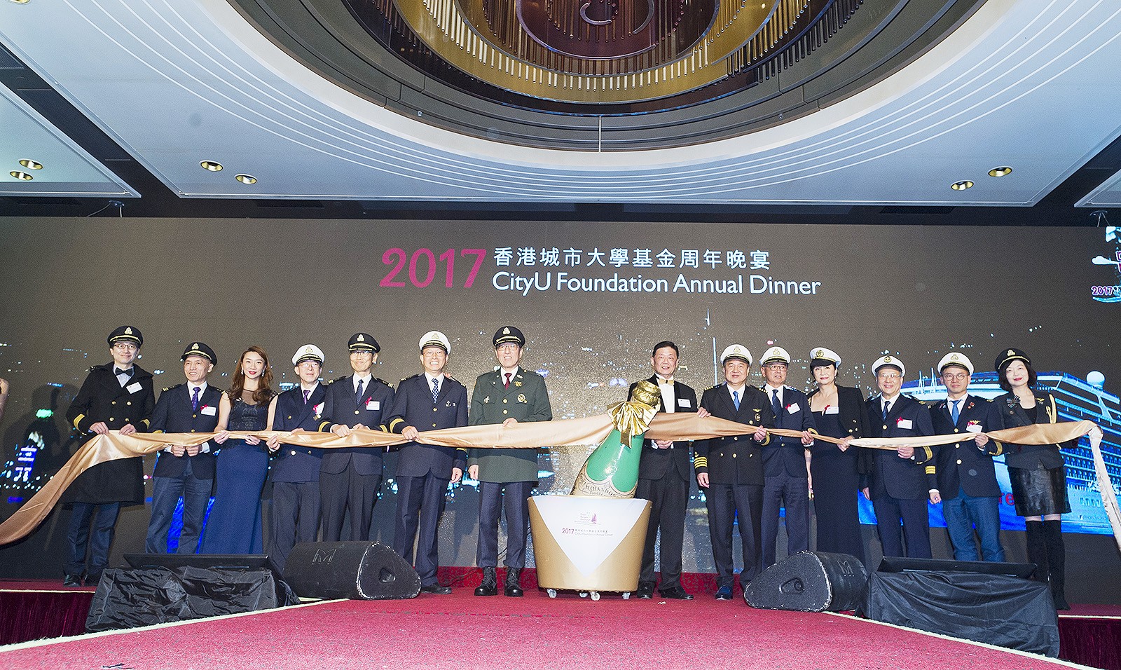 Guests officiate at the kick-off ceremony of the dinner.