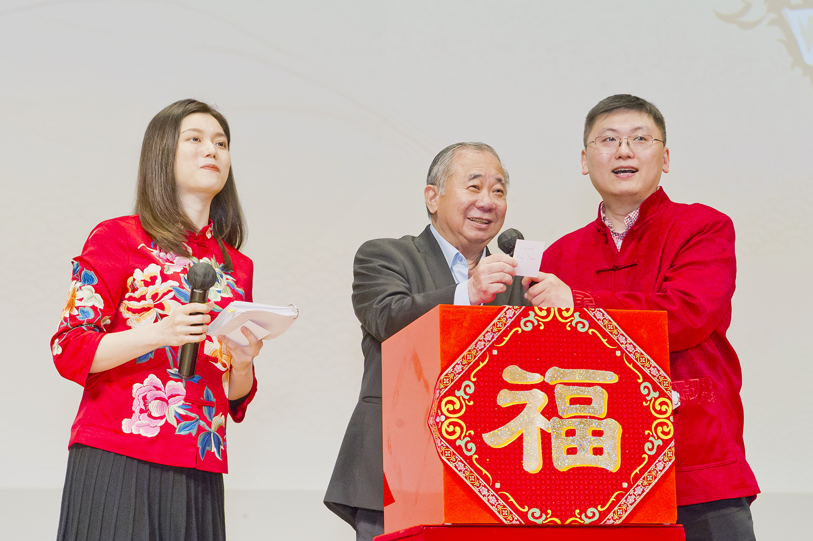 President Boey announces a winner in a lucky draw.