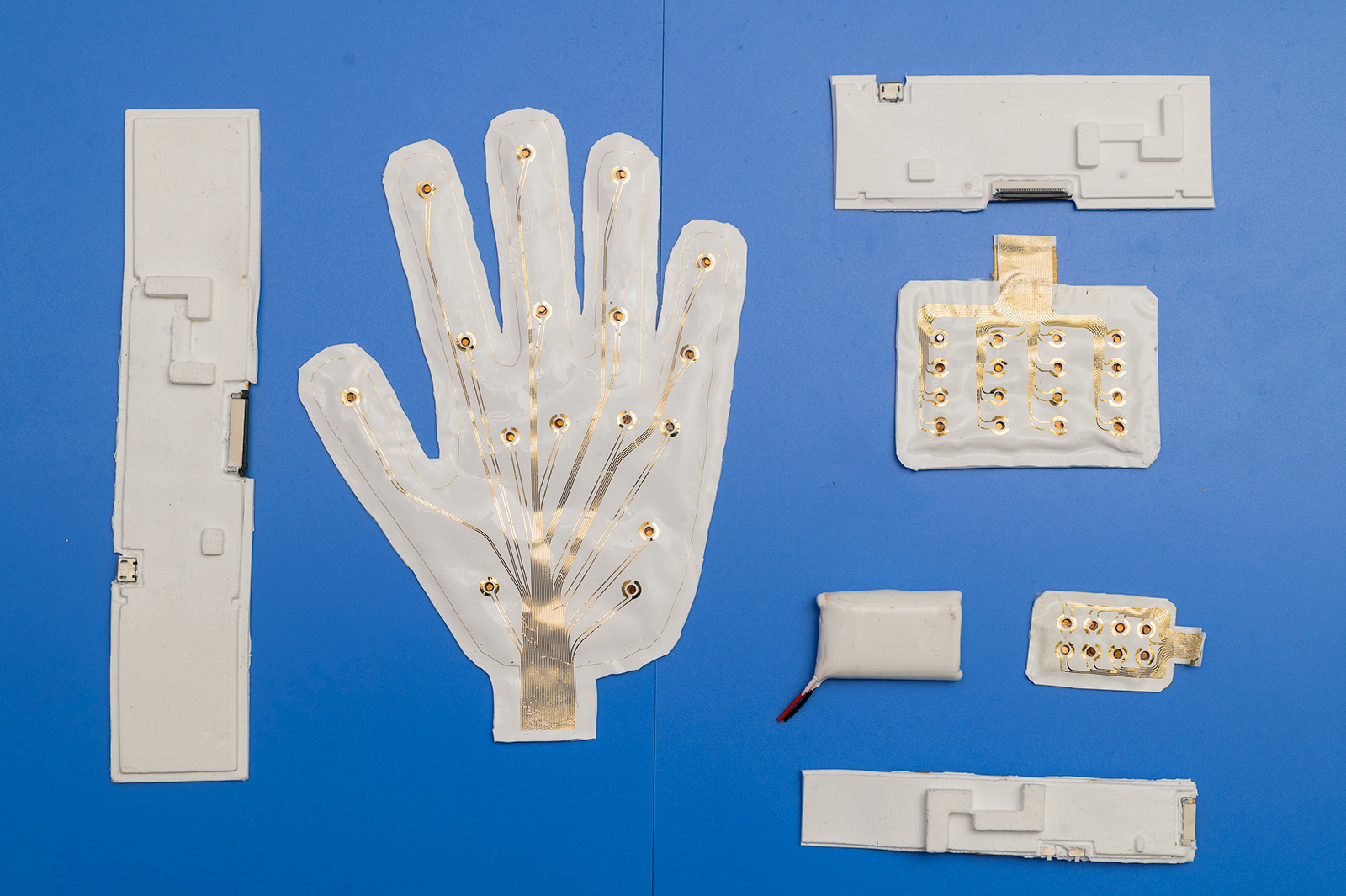 Arrays of various haptic feedback units capable of improving the fidelity of virtual mechanical tactile sensations.