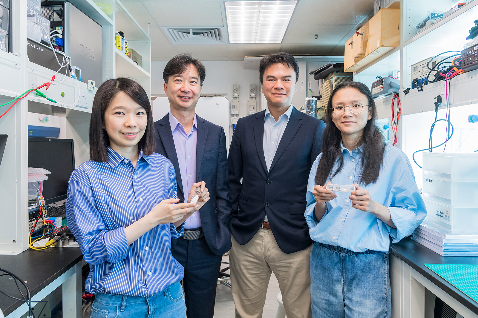 The groundbreaking living passivator developed by Dr Wang (from left), Professor Feng, Professor Yip and Dr Zhou, another first author of the paper, significantly improves the performance and durability of perovskite solar cells.