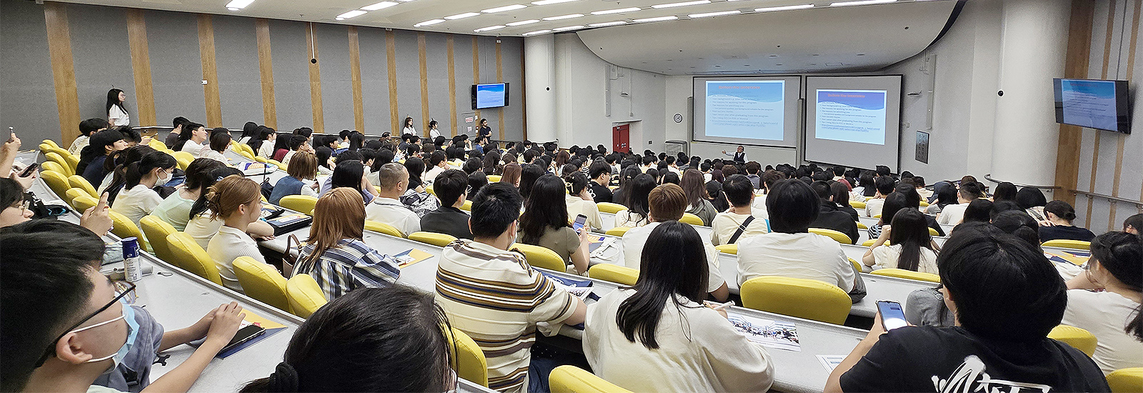 The event opens with a keynote admission talk, drawing a full house.