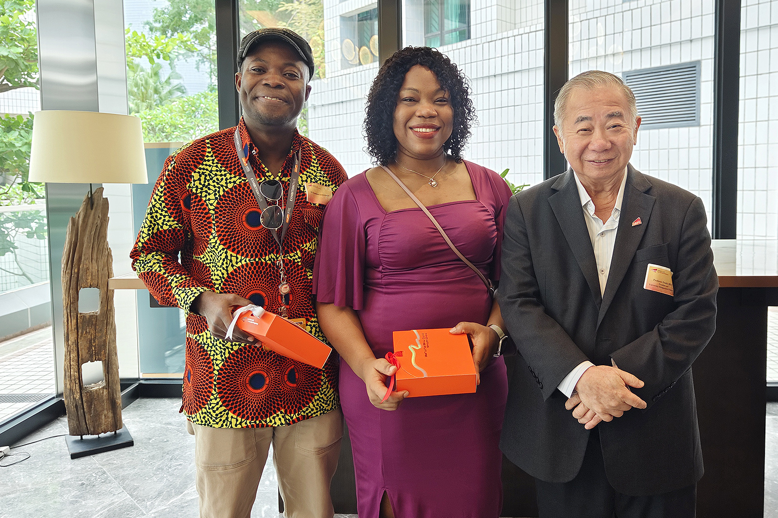 President Boey (right) thanks Dr Emmanuel Koomson (left) and his wife Dr Sally Mingle Yorke (centre) for strengthening the African alumni network.