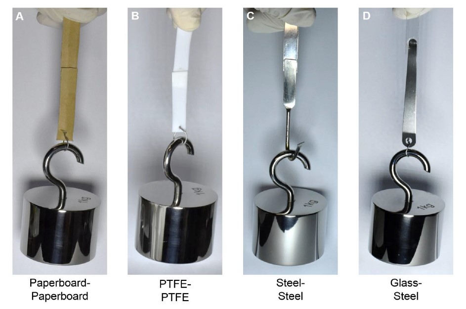 Application of DOSS as adhesive materials on paperboard, PTFE, stainless steel and glass with a glued area of only1 cm2.