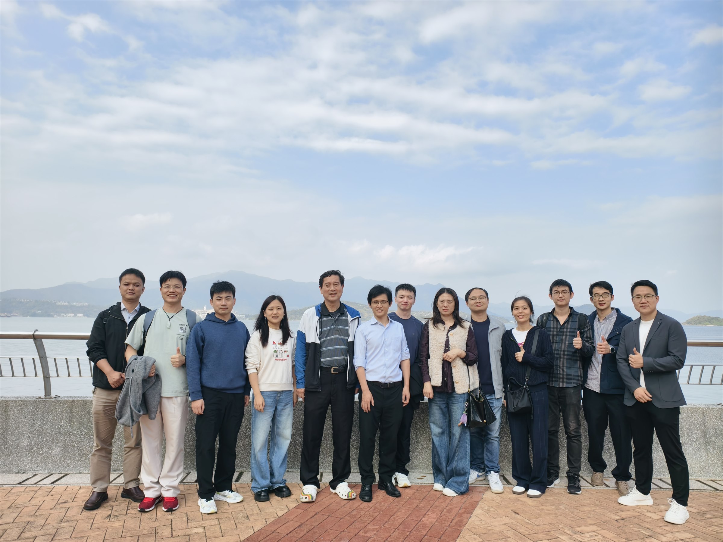 ANSD researchers and collaborators in a group photograph by the waterfront