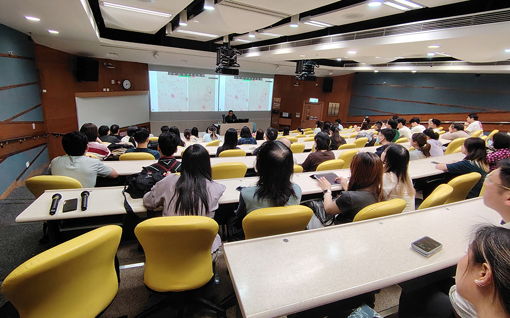 Audience members engaged in the discussion on microbial morphology.