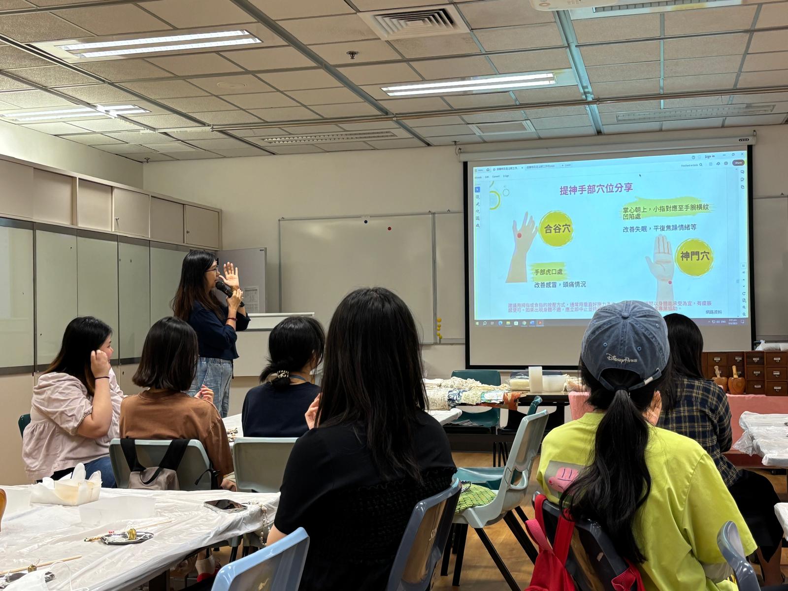 The instructor was explaining the different acupressure points on the hands.