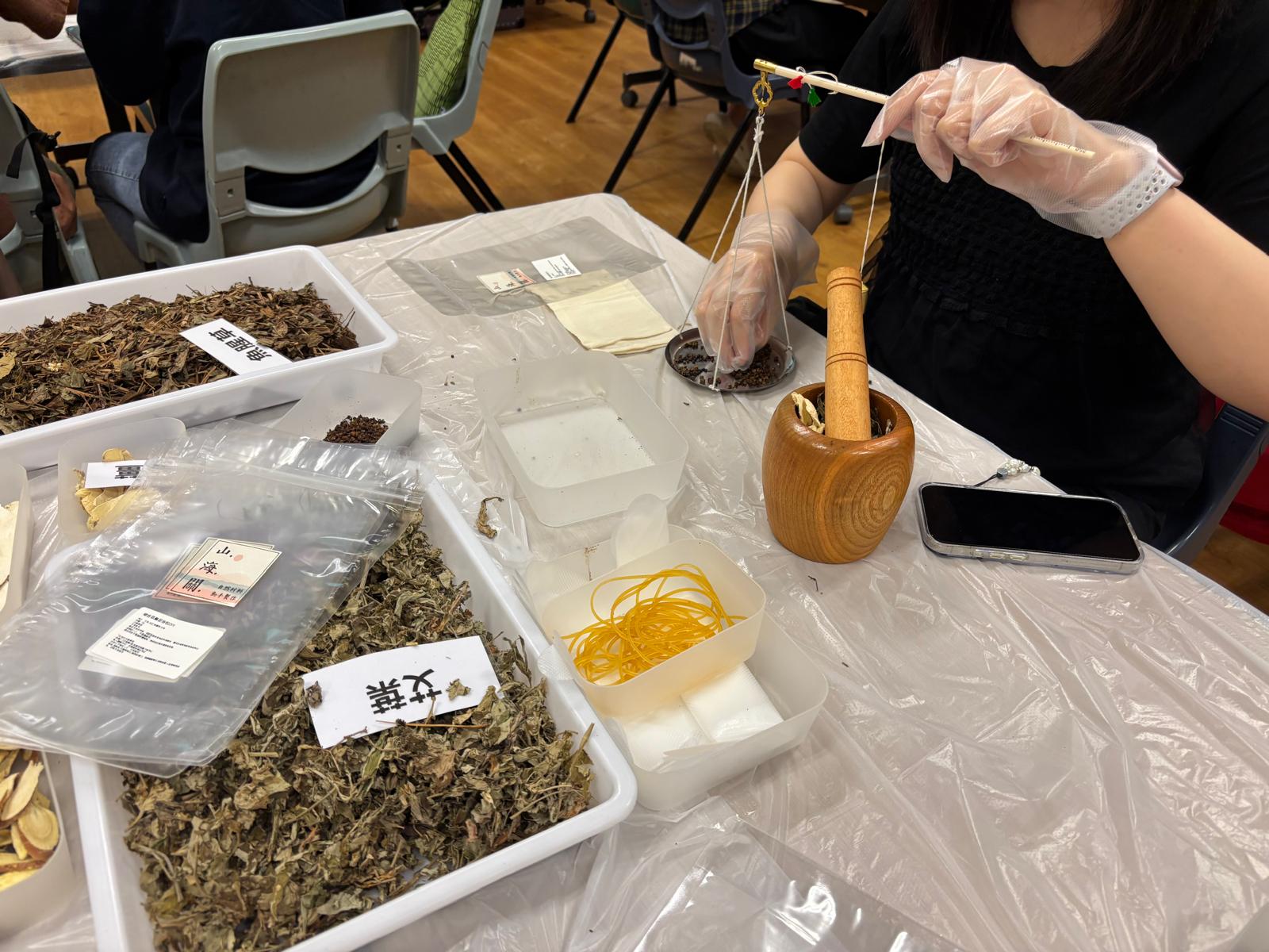 The students were making herbal foot soak bags.