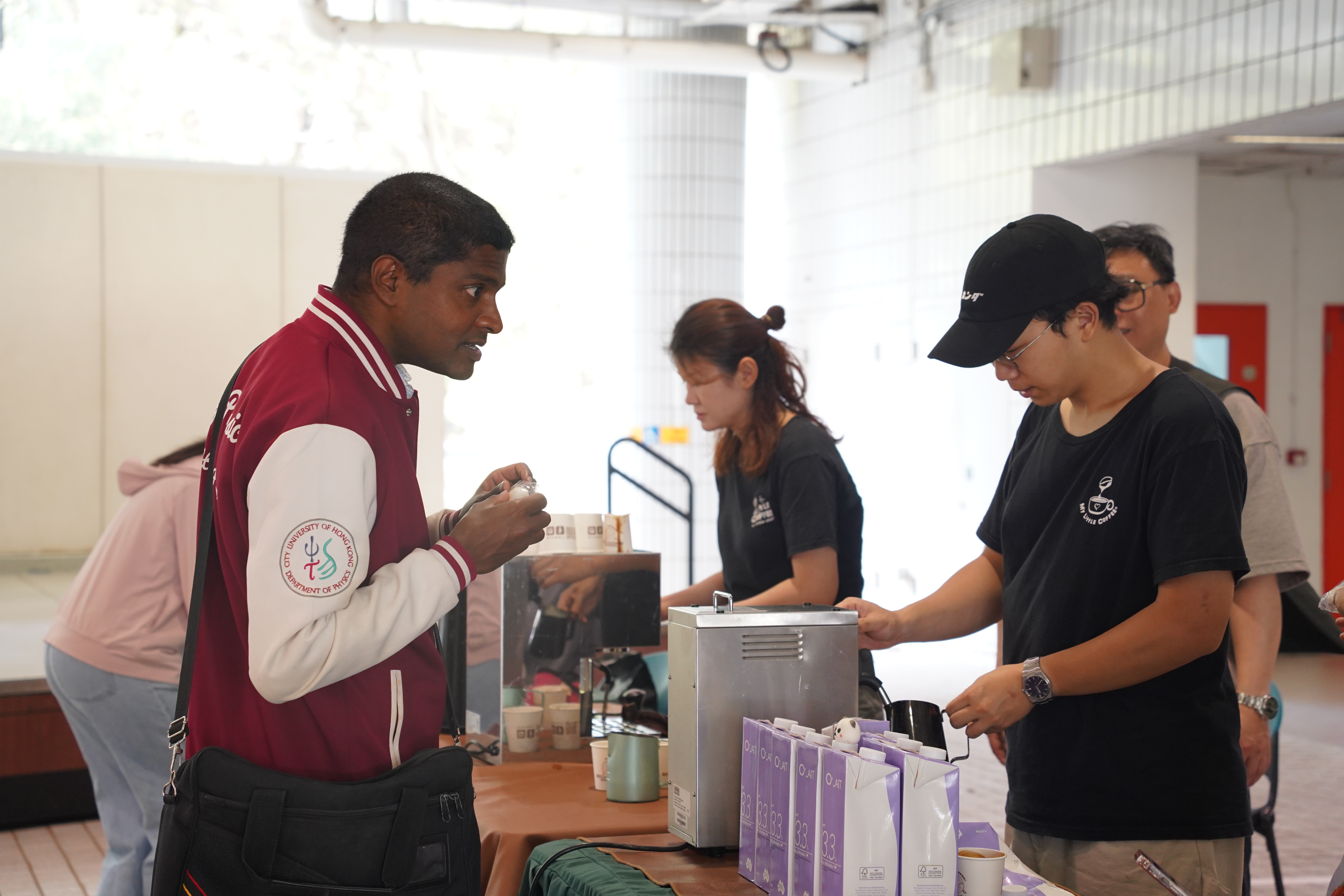 The students were queuing to receive coffee.
