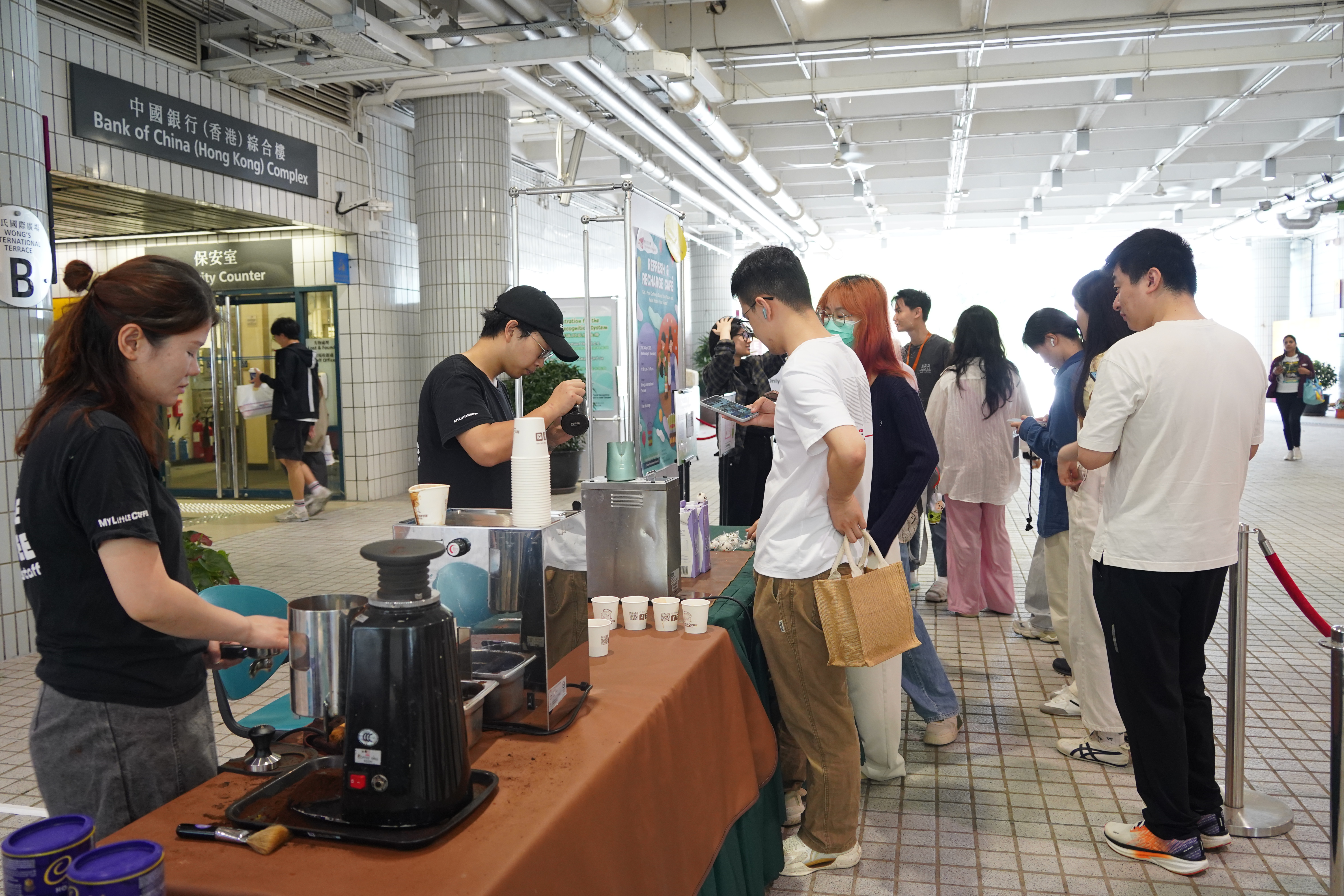 The students were queuing to receive coffee.