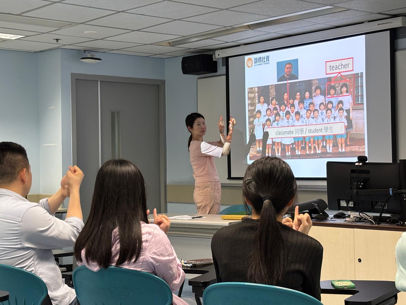 The deaf teacher was teaching sign language for personal titles.