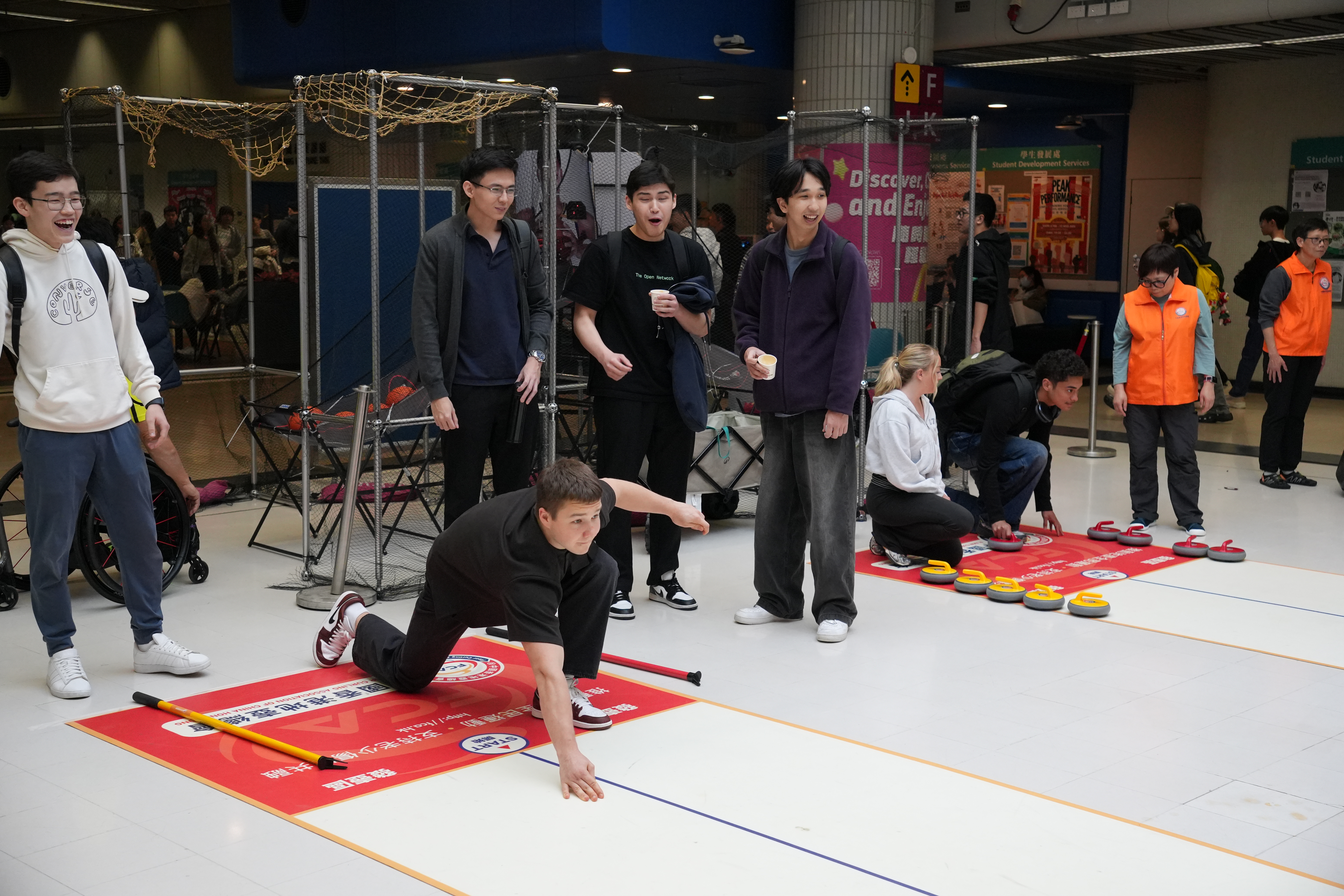 The students were playing floor curling.