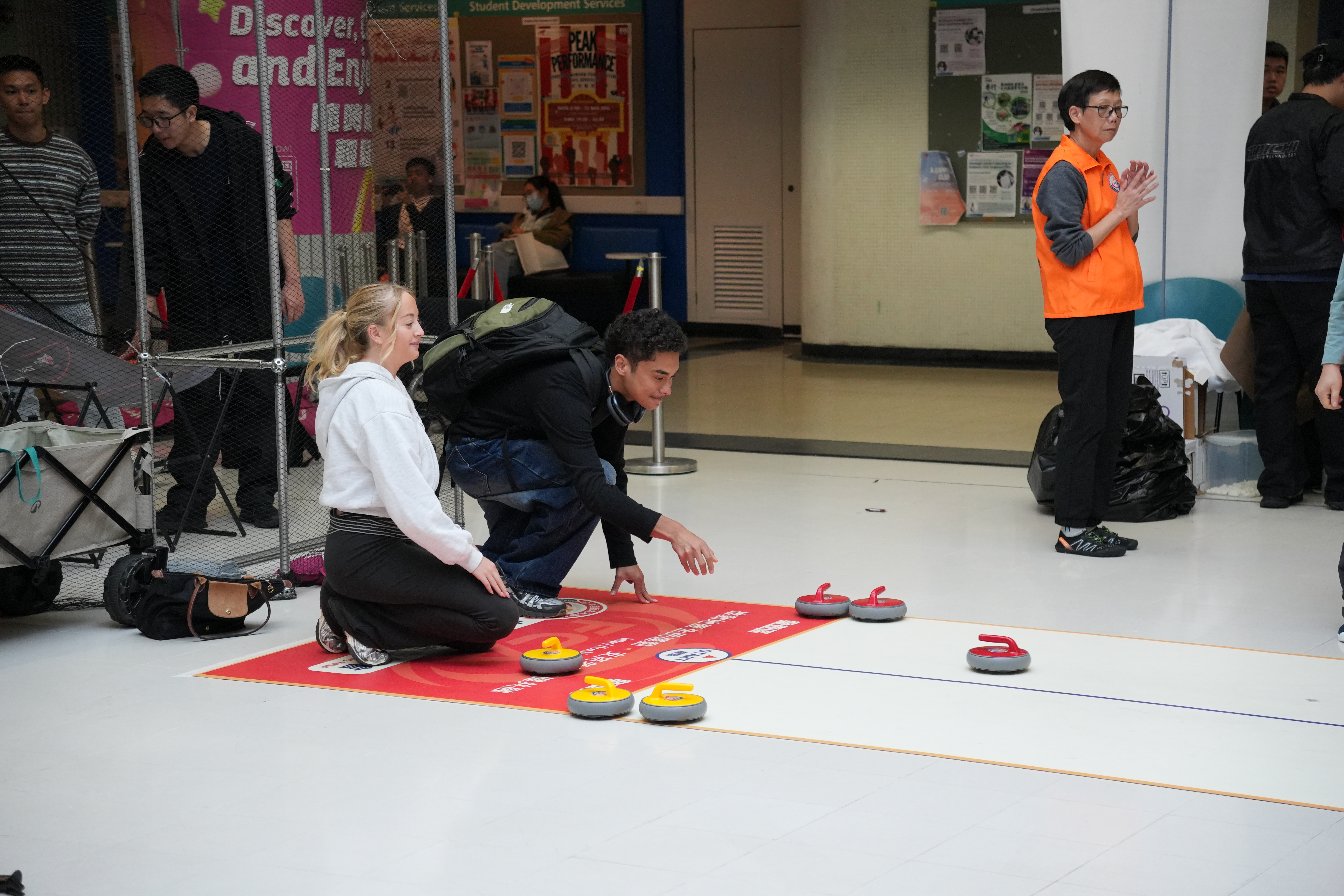 The students were playing floor curling.