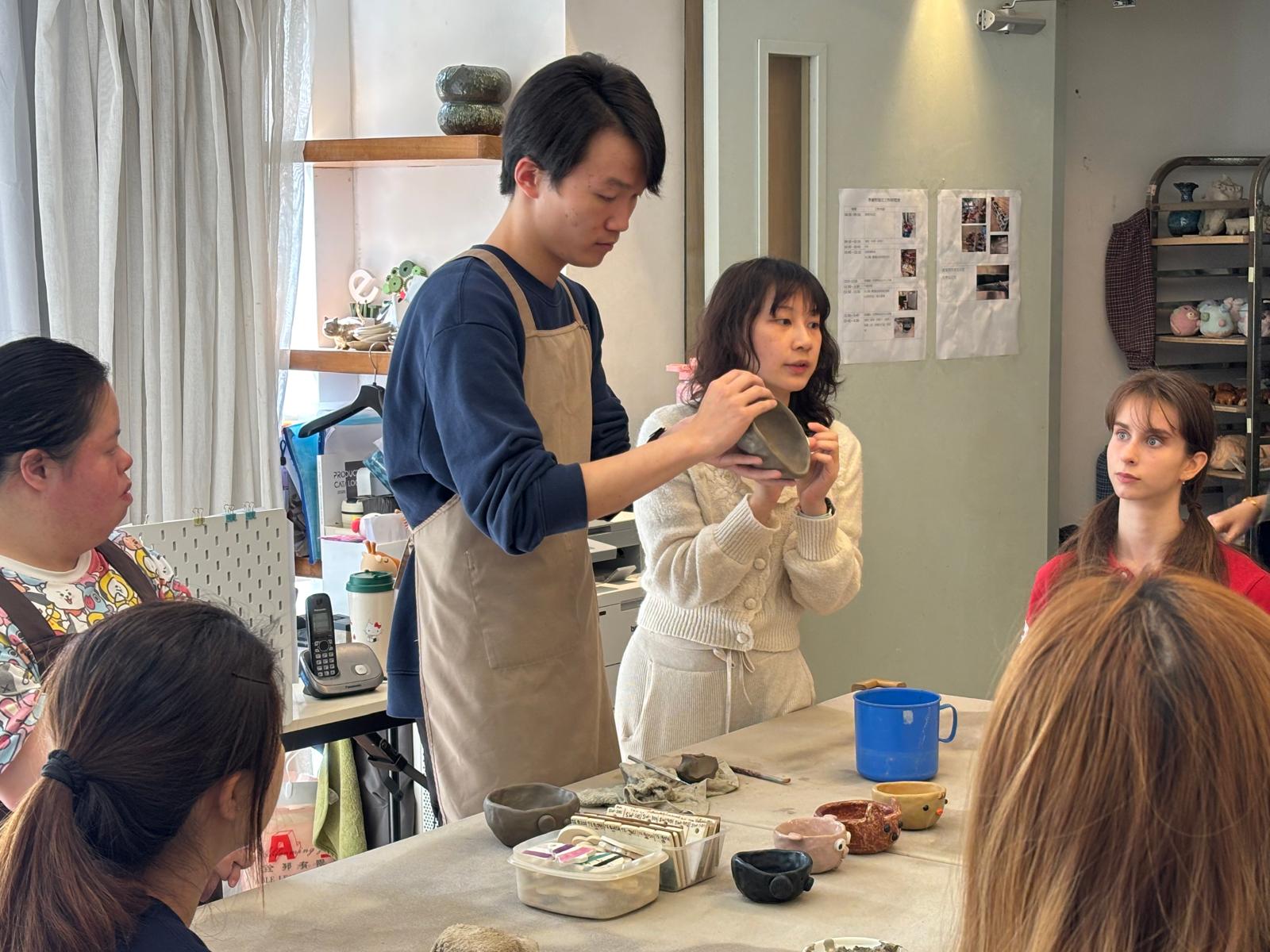The instructors were explaining how to make ceramic bowls.