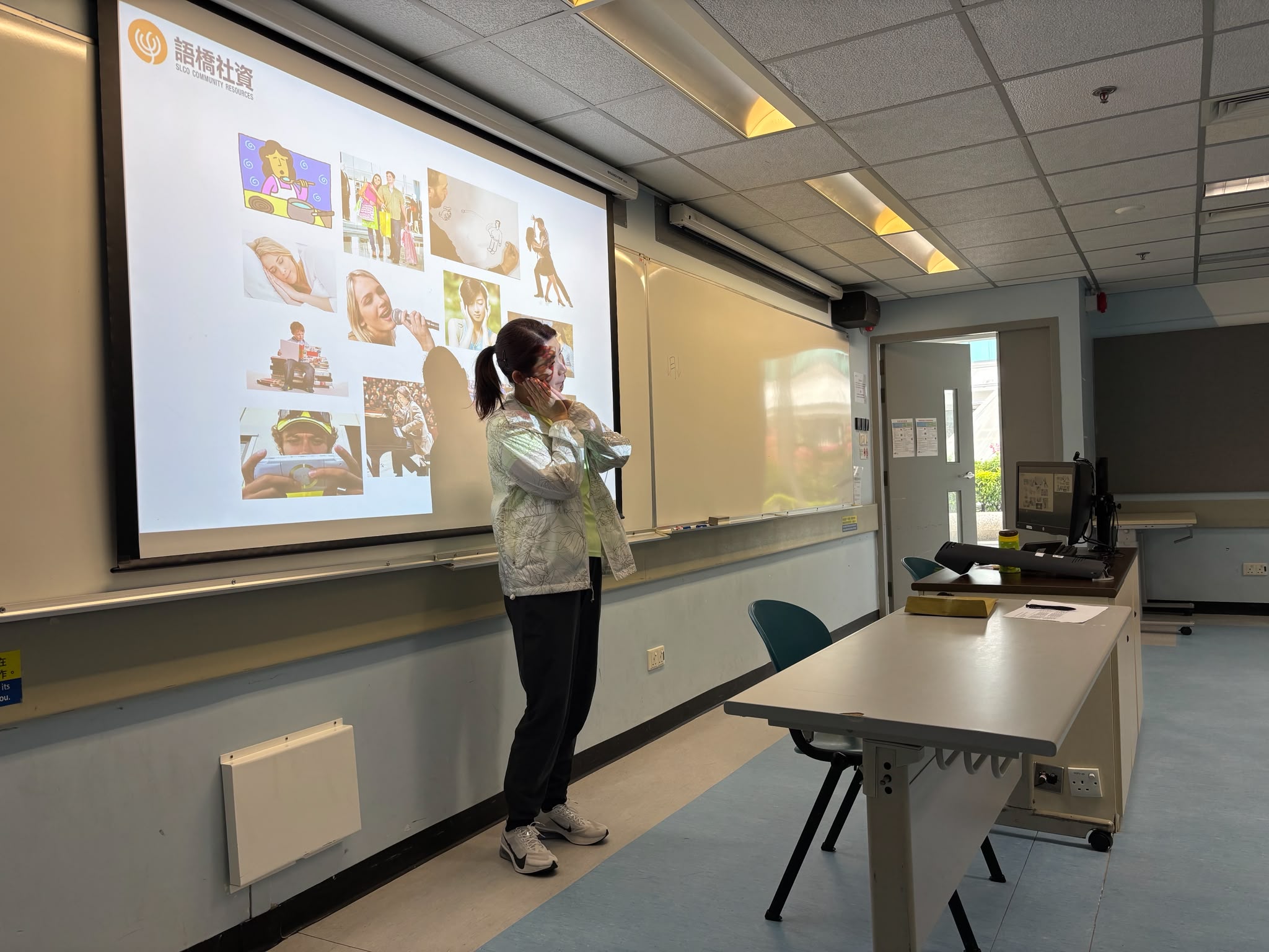 The deaf instructor was demonstrating sign language for different interests.