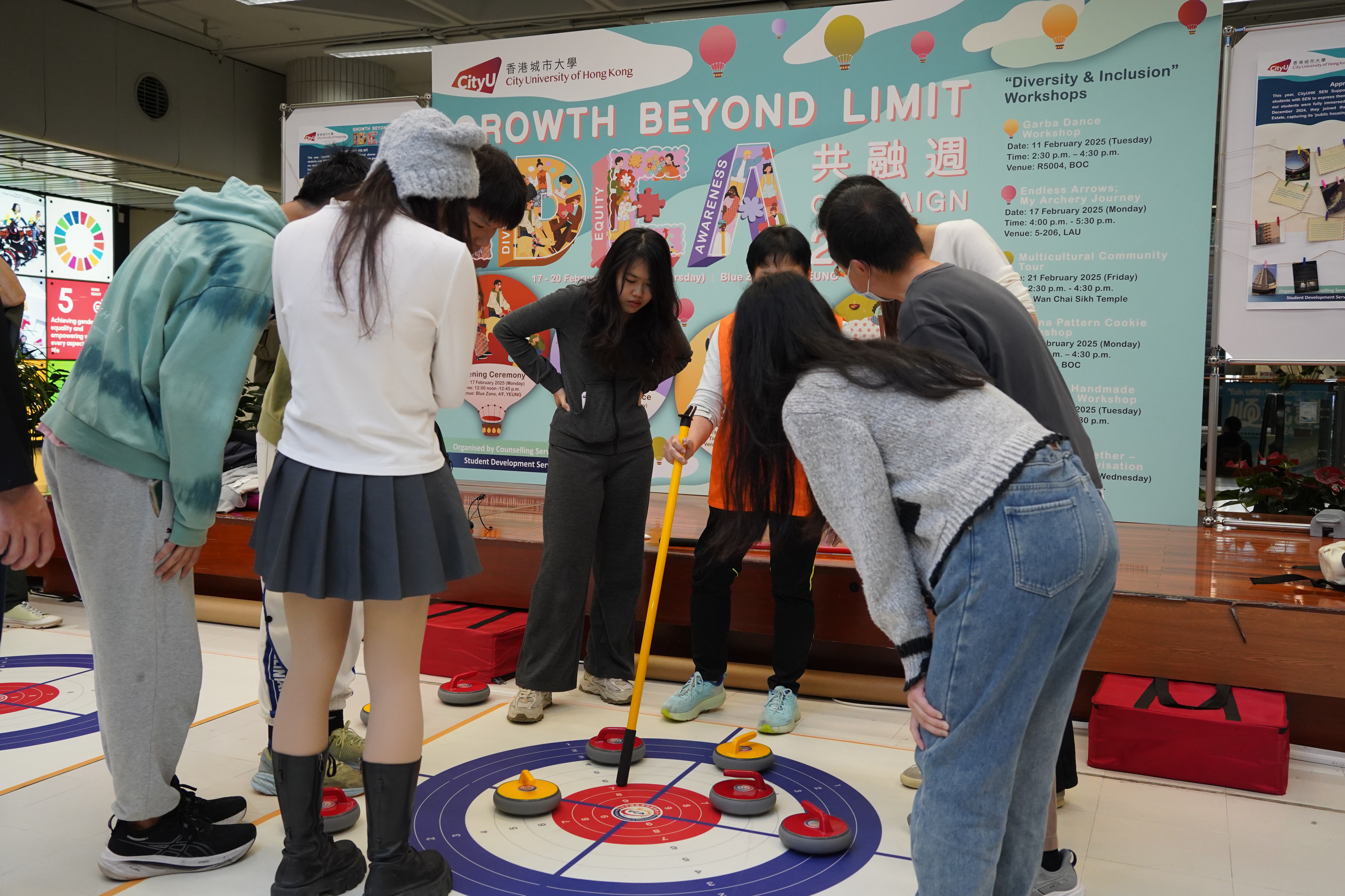The instructor was explaining how to play floor curling.