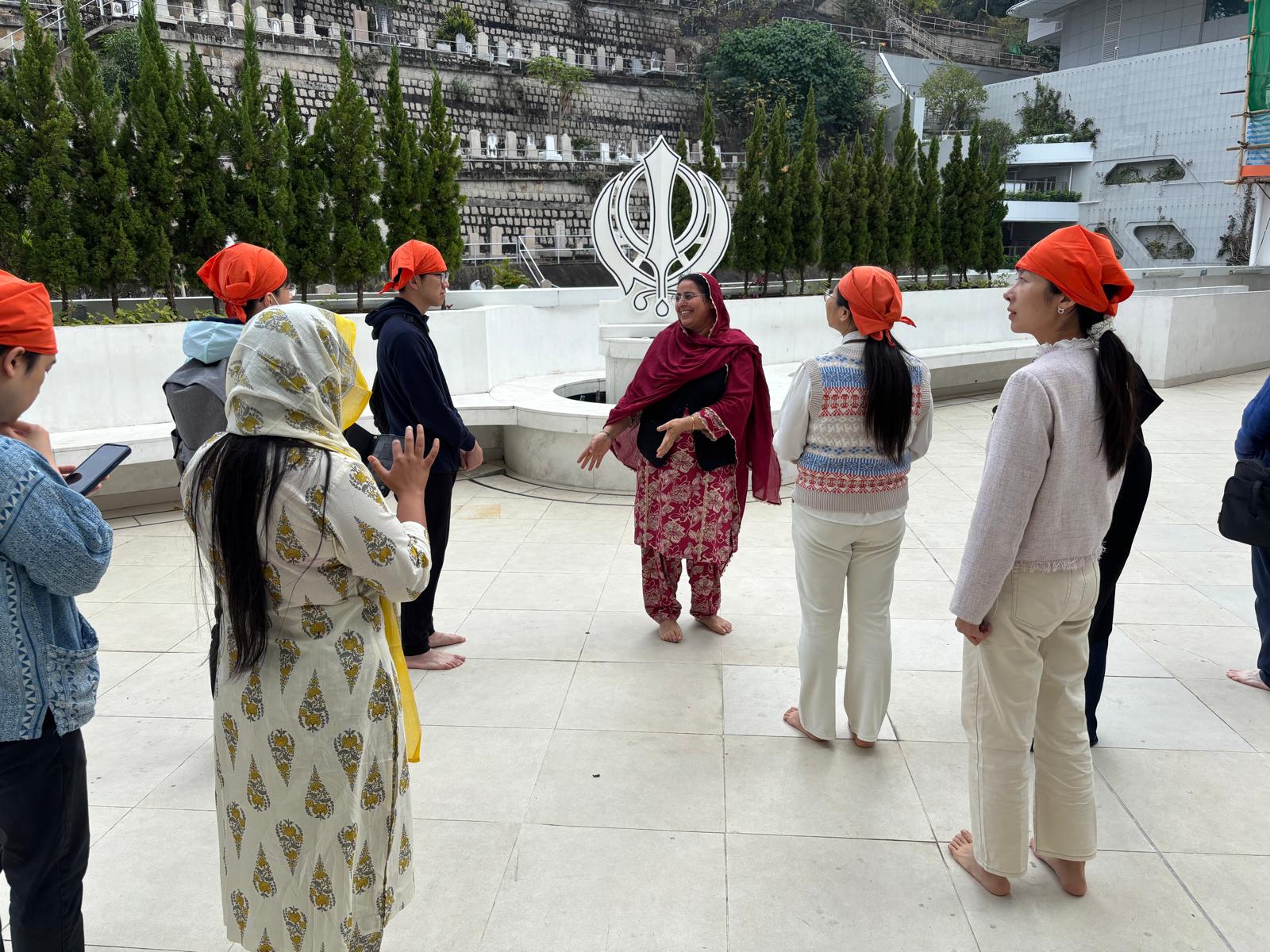 The guide was introducing the history of the Sikh temple.