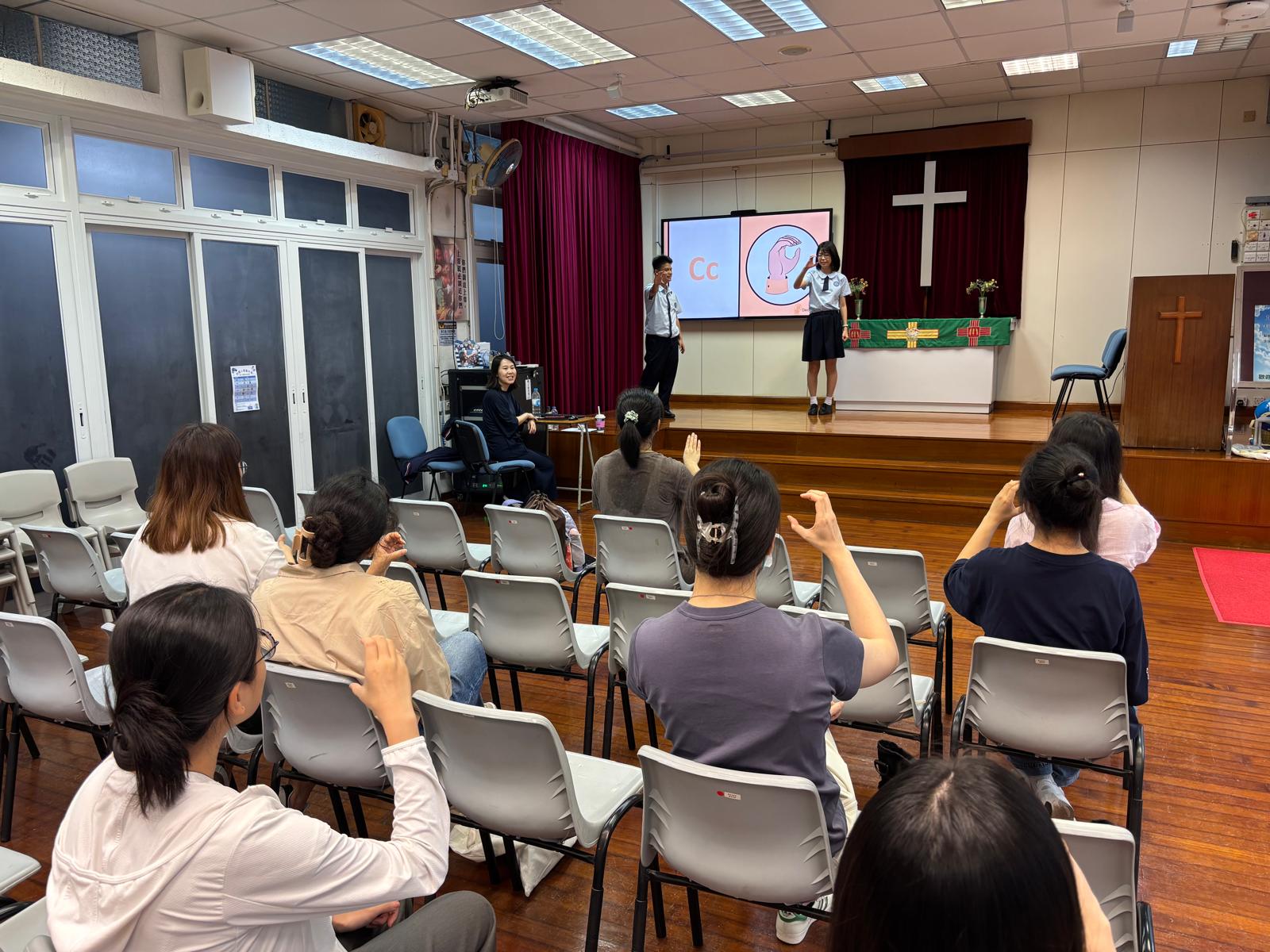 The deaf students were teaching CityUHK students sign language.
