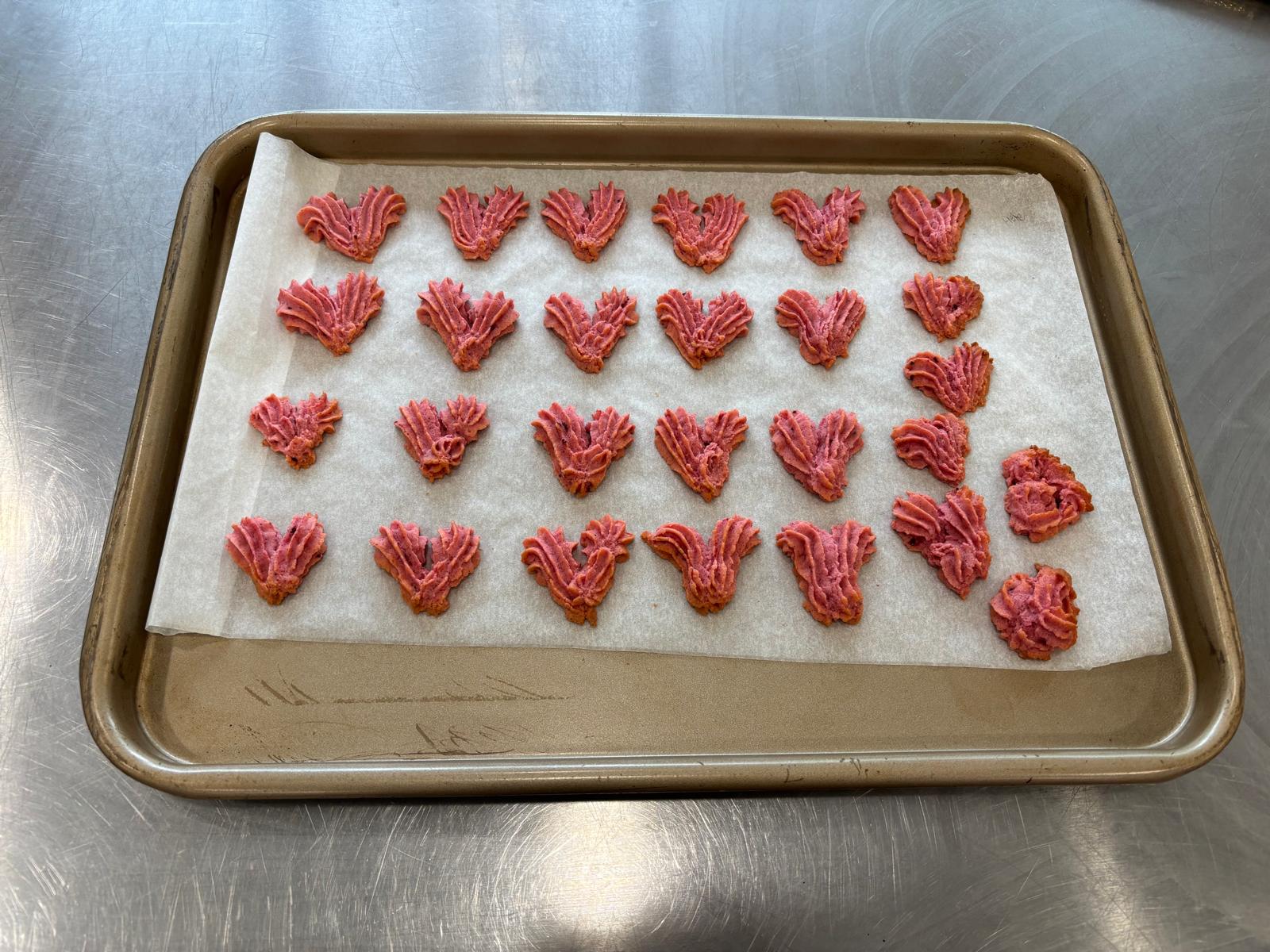 The student was making heart-shaped cookies.