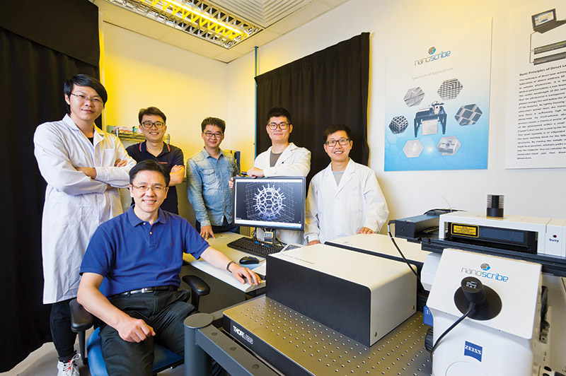 Professor Sun (front row) and his research team.