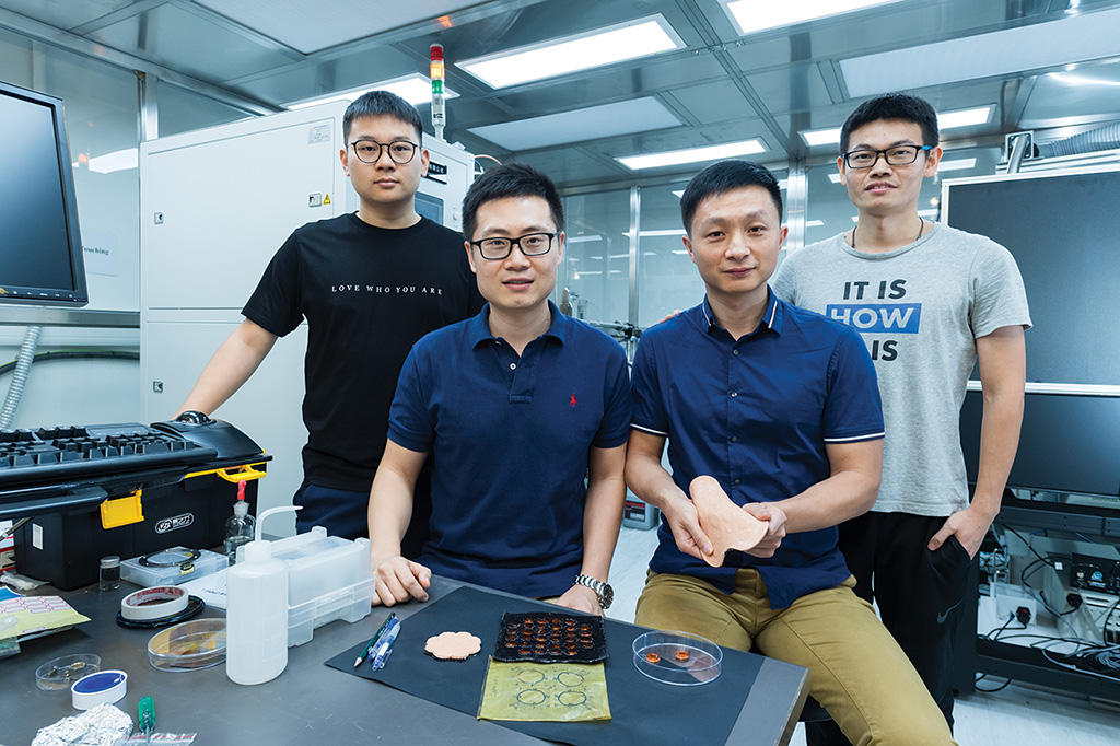 Dr Yu Xinge (front row, left) and his research team at CityU.