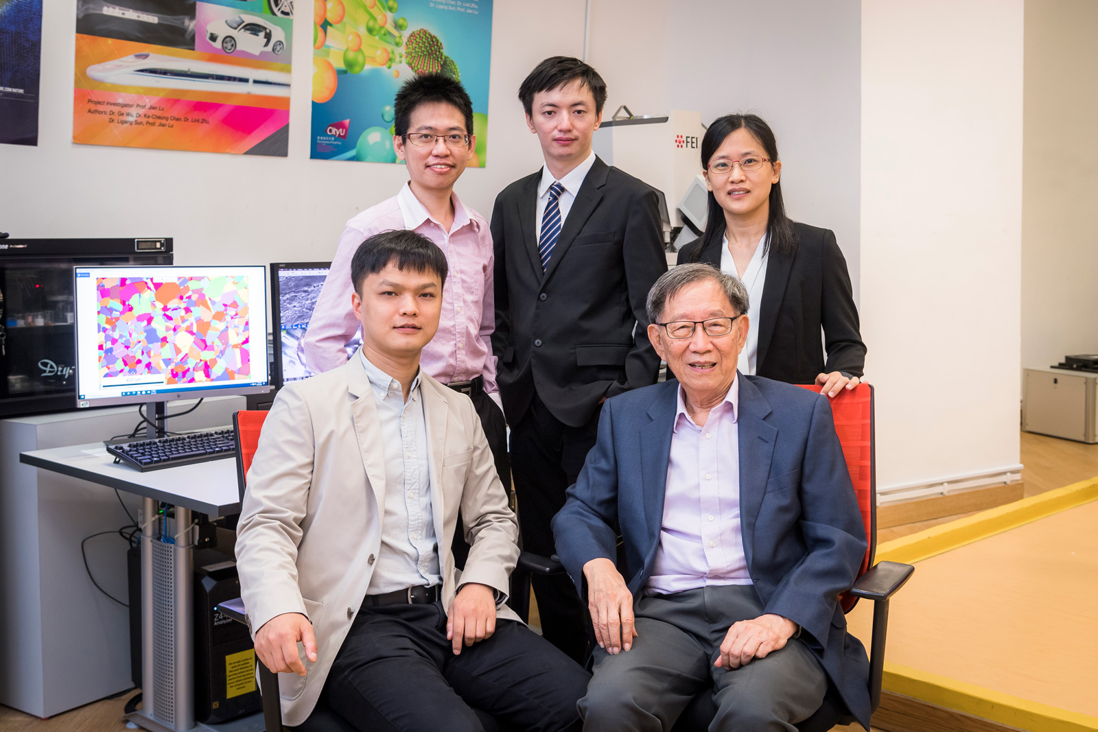 Professor Liu Chain-Tsuan (front row, right), Dr Zhang Tianlong (back row, centre) and the team successfully developed new titanium alloys by using 3D printing.