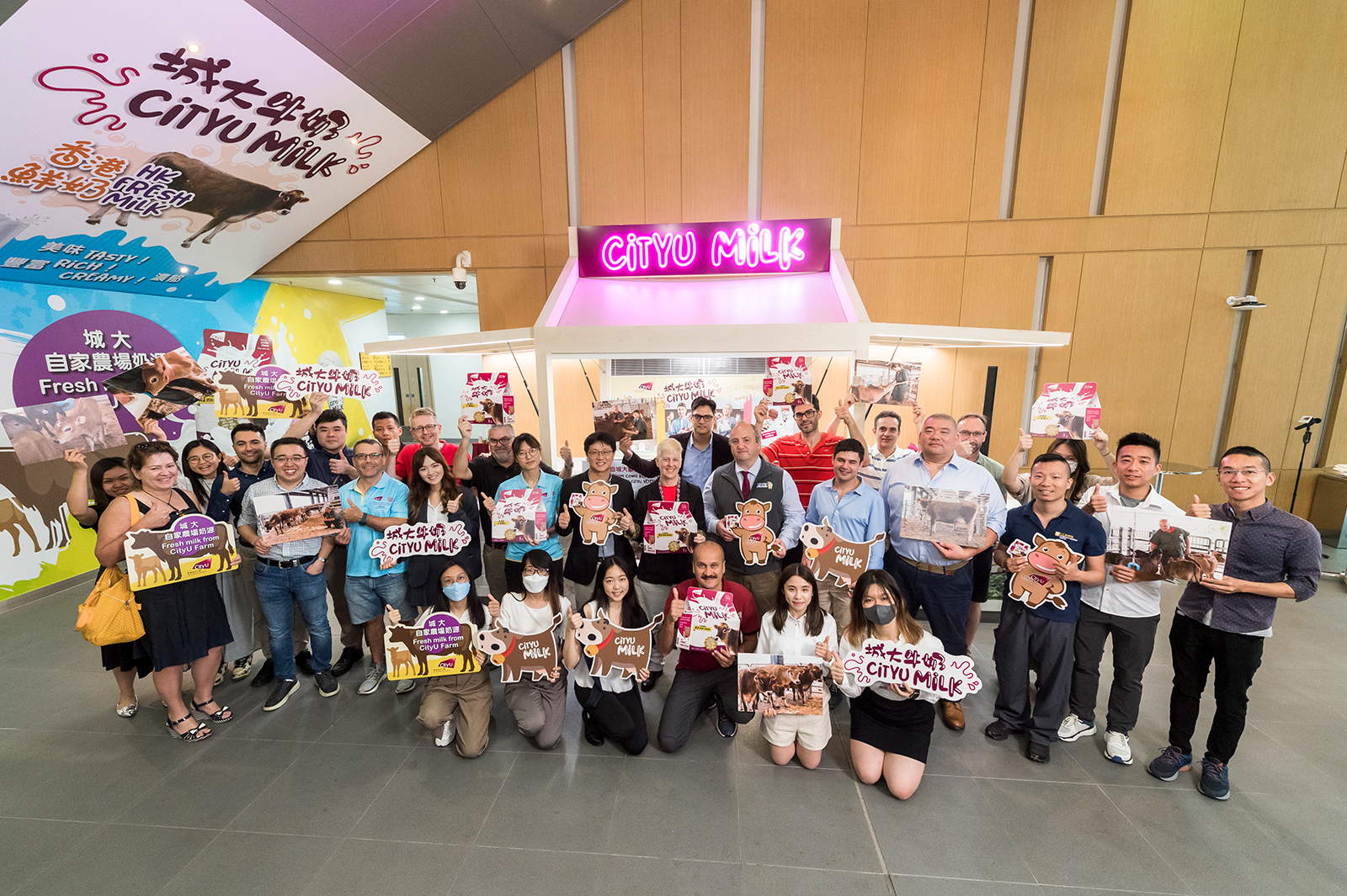 CityU staff and students celebrate the opening of the CityU Milk Product Counter.