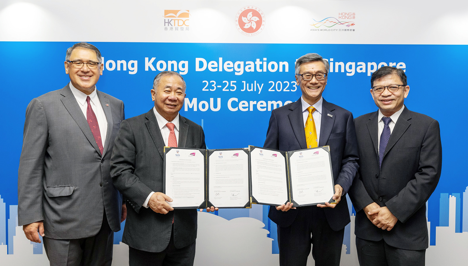 Professor Boey (second from left) and Professor Tan (second from right) exchanged the MoU, witnessed by Mr Huang (first from left) and Mr Loh (first from right). 