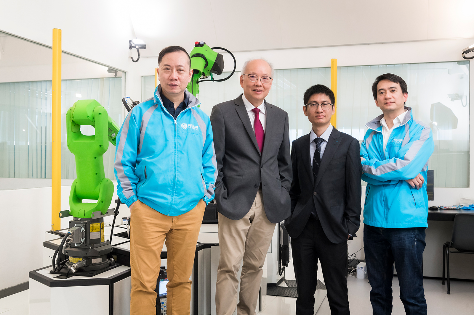Professor Chan (second from the left) leads Dr Chan (first from the left), Professor Wu (second from the right), and Dr Shum (first from the right) in the development of the world's first universal metasurface antenna.