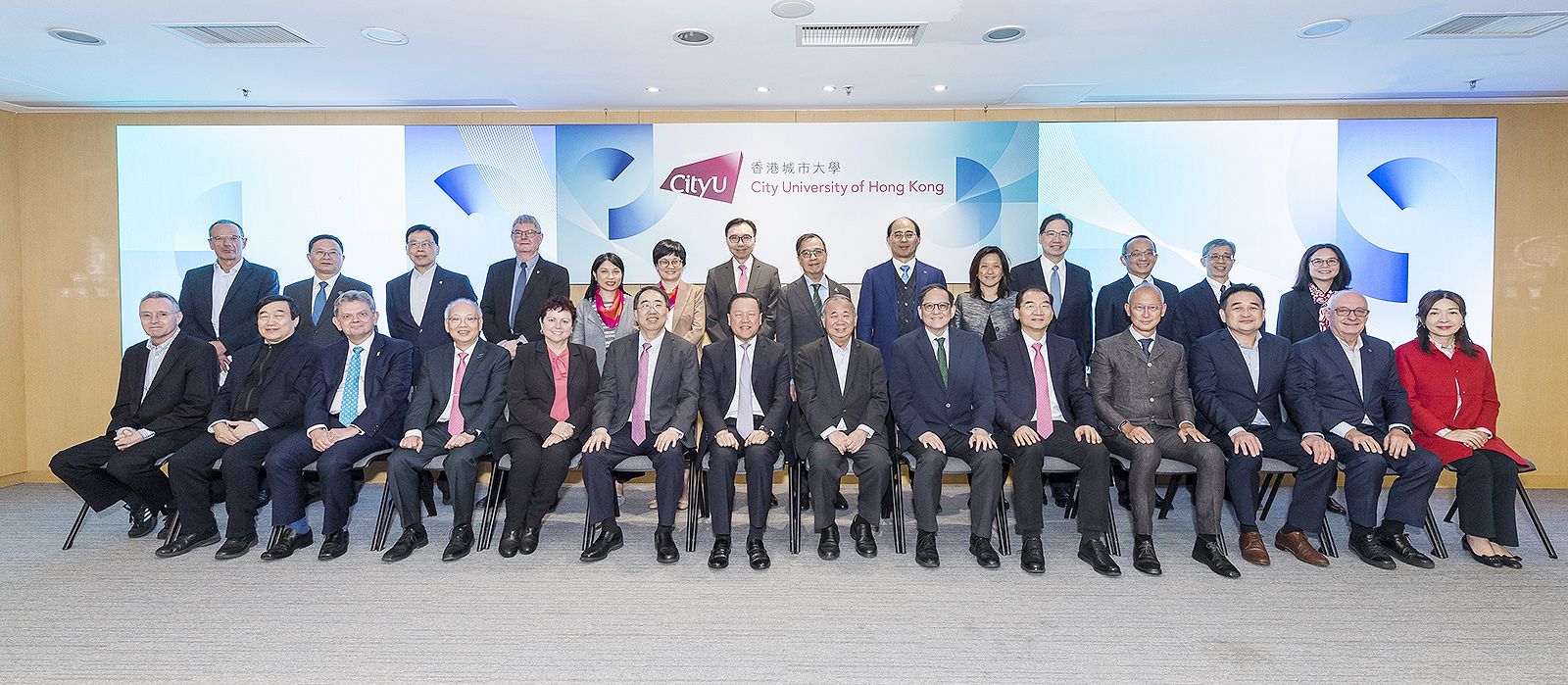 Mr Lui (first row, seventh from left), UGC members and Secretariat staff are warmly received by President Boey (first row, seventh from right) and University management.