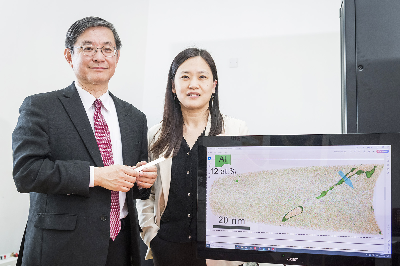 Professor Lu and one of the authors of the Science paper, Dr Luan Junhua (right), a Research Fellow in the Department of Mechanical Engineering.