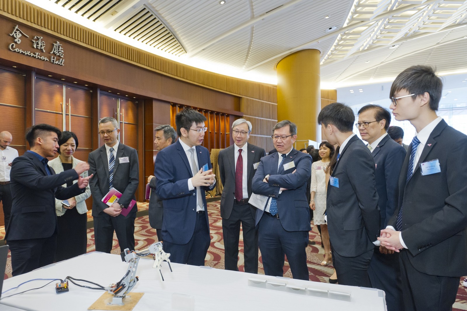 Students from Department of Mechanical Engineering introduced to Mr Willy Lin their hand-gesture controlled robot that can ‘self-learn’.