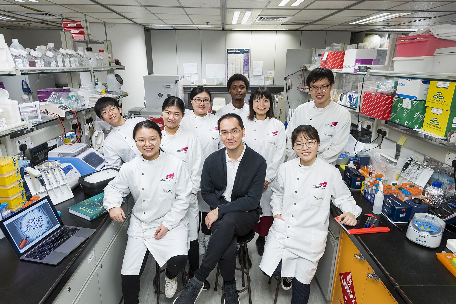 Dr Kwok and members of his laboratory research team.