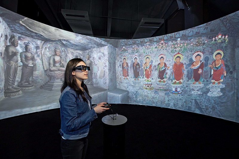 360-degree 3D panorama screen showing the Dunhuang Caves project