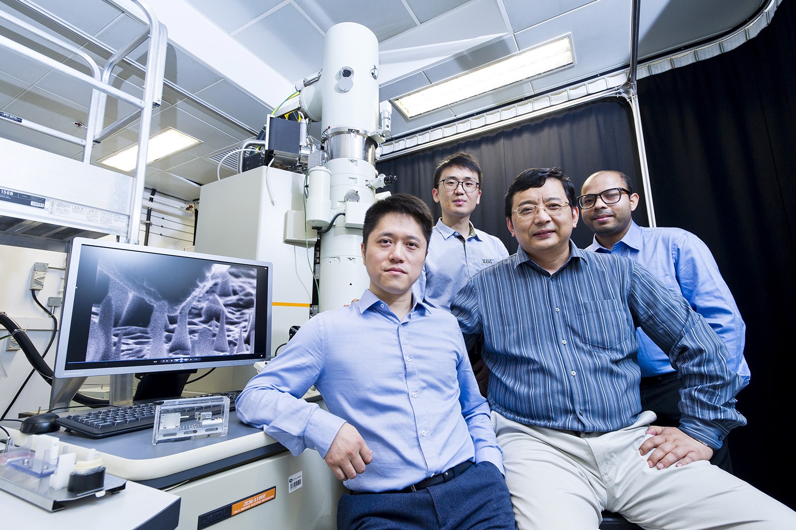 The CityU team has discovered that nanoscale diamond can experience a significant amount of elastic deformation. (From left: Dr Lu Yang, Zhang Hongti, Professor Zhang Wenjun and Amit Banerjee) 