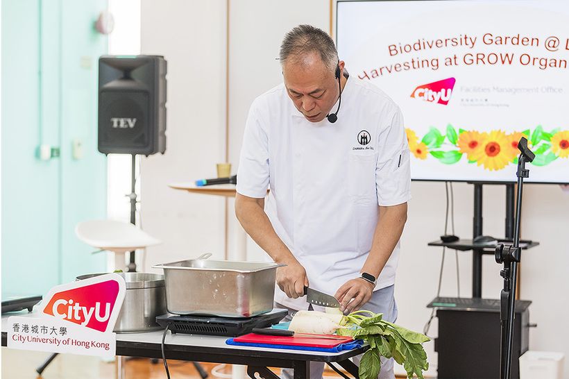 A chef demonstrating cooking with Biodiversity Garden produce at the harvest-sharing workshop