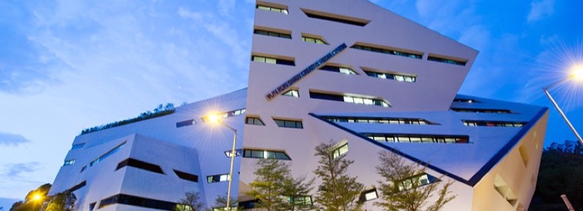 Exterior of a white-tiled CityUHK academic building