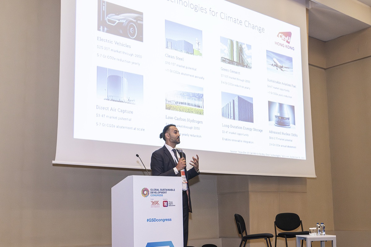 A CityUHK speaker at the Global Sustainable Development Congress lectern, presenting a slide on technologies for climate change