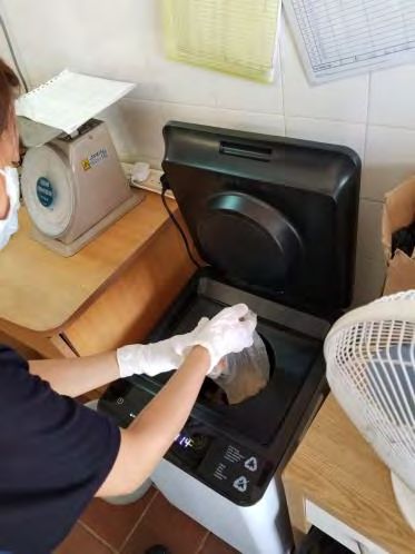 Food waste being processed in a campus food-waste recycler