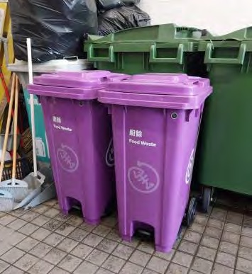 Purple food-waste bins beside general-waste bins at the Student Residence